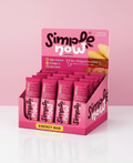 Display of Simple Now energy bars in pink packaging on a white background
